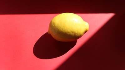 Yellow lemon on the purple fabric
